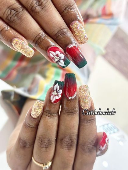 This festive design combines a red and green ombre with gold glitter and a beautiful hand-painted 3D white flower.