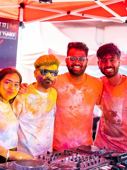 Covered in colors and good vibes at the Holi 2k24 festival. Posing with friends behind the decks during a fun-filled day.