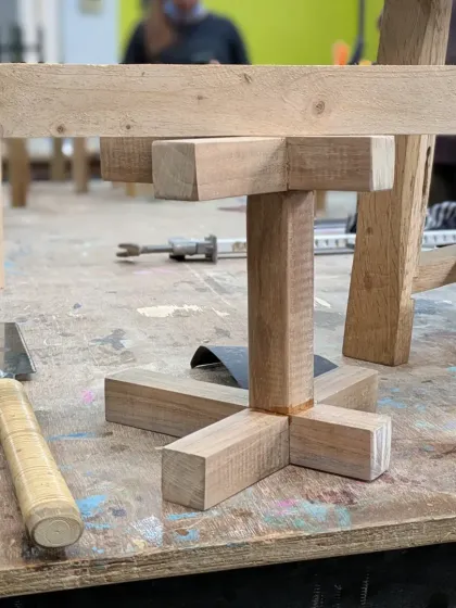 Assembling a small table base using hand-cut joints. A little bit of glue and a perfect fit is all you need to create a strong, lasting bond.