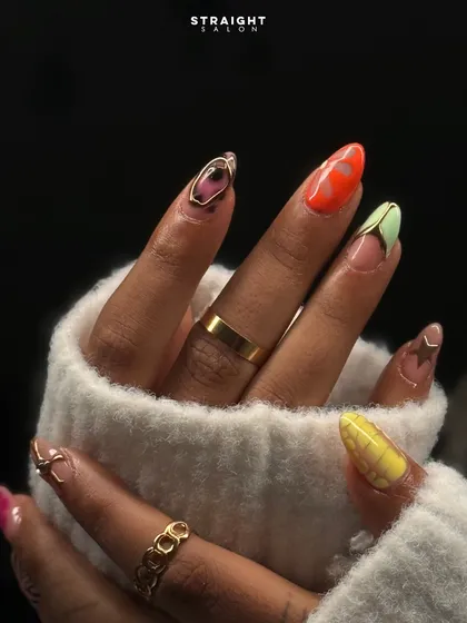 Why choose one style when you can have them all? This mismatched nail art set shows my creative range, combining vibrant colors, patterns, and gold accents for a look that is playful and totally unique.