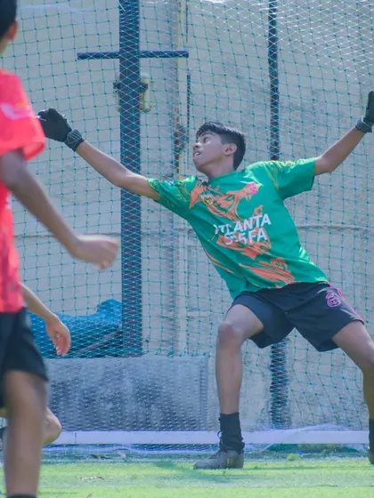 Our U15 goalkeeper making a crucial save, demonstrating bravery and agility.