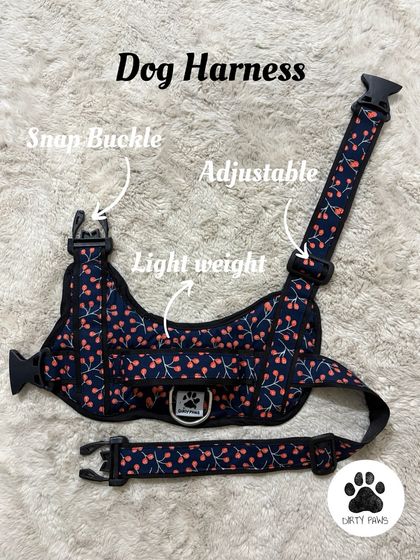 A clear product shot of the cherry print dog harness. This view highlights the adjustable straps and the easy-to-use snap buckles that make gearing up for a walk quick and simple.