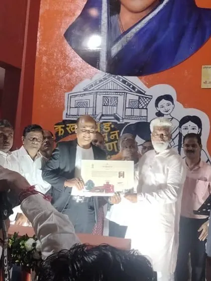 Being felicitated by the Hon. Education Minister of Maharashtra, Shri Dadaji Bhuse Saheb, at an event.