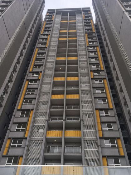 The facade of the Salarpuria Sattva Opus residential tower, where we used a bold color scheme of grey and yellow to create a modern and energetic architectural statement.