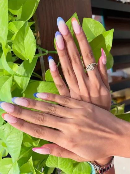 For when you're feeling a little more playful. These long, almond-shaped extensions with colorful French tips are so trendy and eye-catching. A perfect look for your next vacation or brunch date.