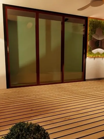 This terrace features a beautiful wooden deck, hexagonal wall tiles mixed with moss, and a water feature. The design includes a sacred Banyan bonsai, adding a spiritual and grounding element to the modern space.