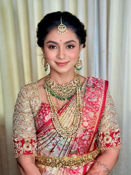 A modern take on traditional glam, this look features soft, neutral eye makeup and elegant jewellery for a Muhurtham ceremony.