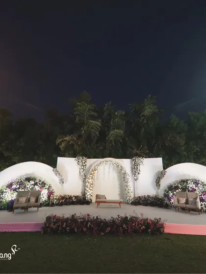 Another angle of the unique wave-like floral backdrop, demonstrating its scale and the beautiful texture created by the dense flowers.