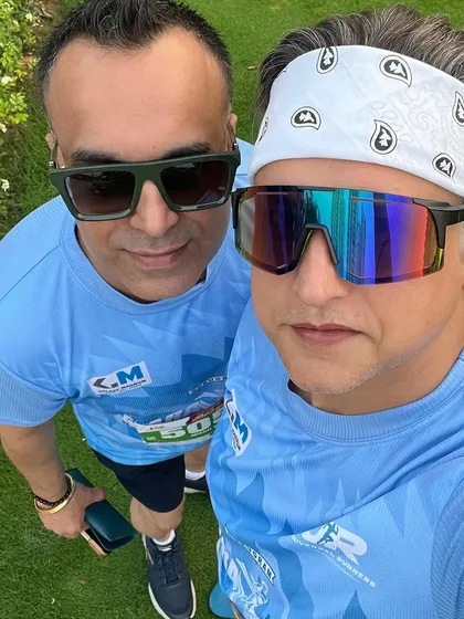 Two members at the Grand Marathon. The support of a friend can make all the difference on race day.