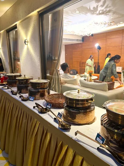 The right presentation makes the food taste even better. This is my elegant buffet setup featuring hammered copper-finish serving dishes, perfect for adding a touch of class to your corporate events and celebrations.