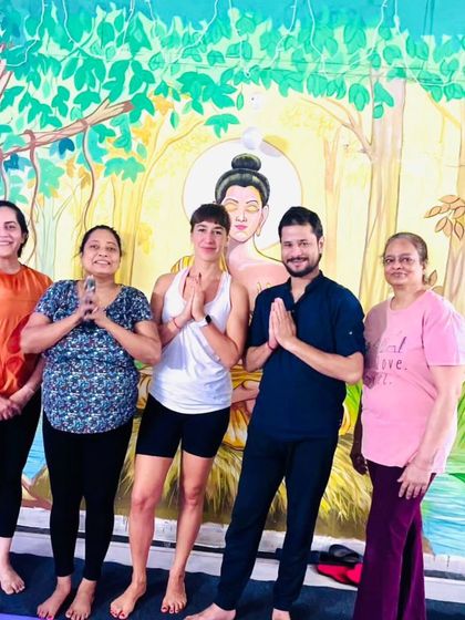 A group photo celebrating a shared practice. The smiles on their faces show the joy and sense of accomplishment that comes from practicing together.