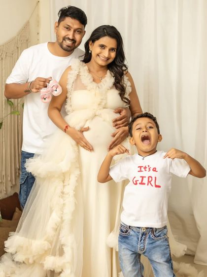 It's a girl, and the big brother's excitement is contagious. This is a perfect family announcement photo, full of energy and happiness.