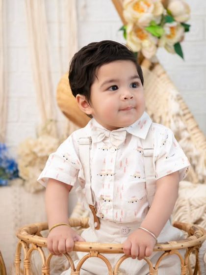 A sweet portrait of a one-year-old in a wicker bassinet. The combination of natural materials and soft florals is the essence of my rustic-chic style.