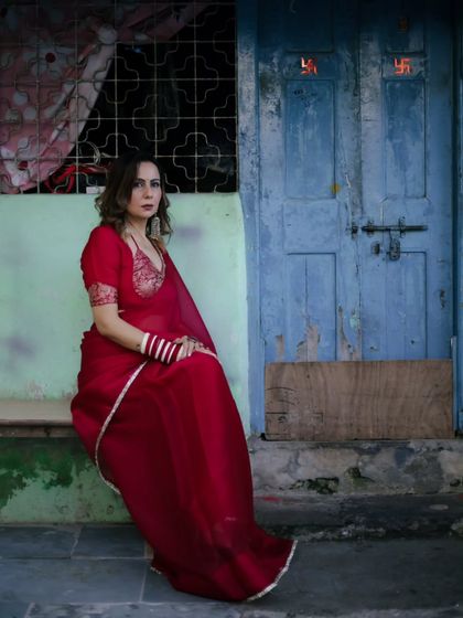 A slightly different composition of the previous scene, this shot feels more intimate. Her direct gaze connects with the viewer, making the portrait more engaging and personal.