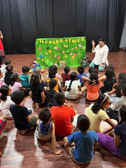 A wide shot of a puppet show in progress at a studio. I bring my own portable theatre, which can be set up in any space.