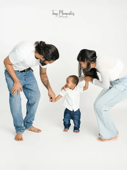 Guiding his first steps. Capturing these major family milestones is an honor, preserving the memory of teamwork and encouragement.