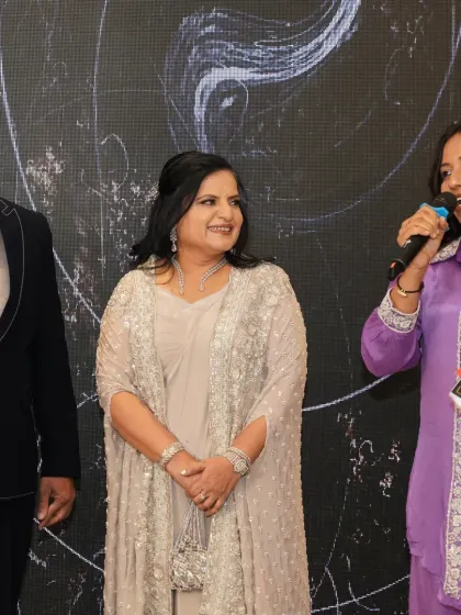 A candid moment interacting with the anniversary couple on stage. These conversations help bring out the beautiful, unscripted moments of connection.