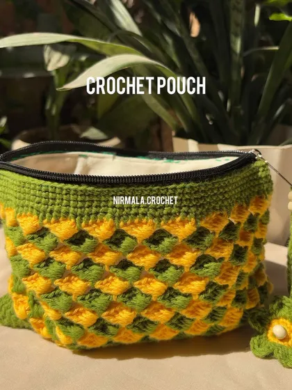 Another view of our scale stitch pouch, highlighting its shape and the quality of the inner lining. It's a sturdy and stylish choice for your small items.