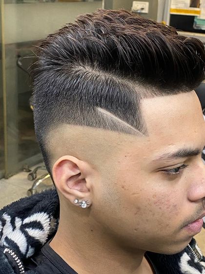 A close-up look at the precision of my line work. The clean, sharp lines are carved into a high skin fade for maximum contrast.