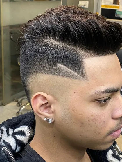 A close-up look at the precision of my line work. The clean, sharp lines are carved into a high skin fade for maximum contrast.