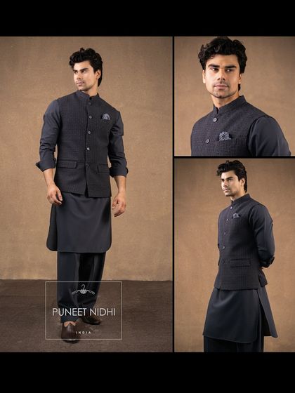 A charcoal grey brick-textured jacket paired with a tonal pathani kurta and salwar. A sophisticated option for summer weddings.