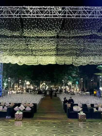 For this Sangeet, we transformed an outdoor space into a celestial wonderland. A vast canopy of thousands of fairy lights created a star-studded sky, setting a dreamy, glamorous tone for a night of celebration and dance.