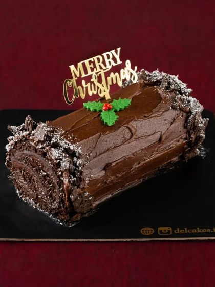 My Chocolate Yule Log is a rich, decadent treat, dusted with powdered sugar 'snow' and a holly garnish. It's a simple and elegant dessert to complete your Christmas feast.