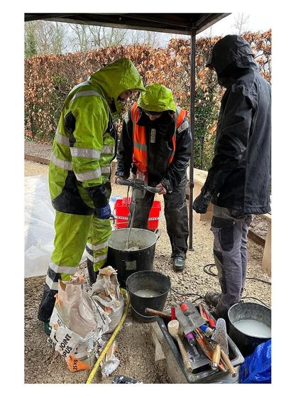 Collaboration on site, even across language barriers. Our team works with local French craftspeople, mixing materials and sharing techniques to execute the design with precision and care.