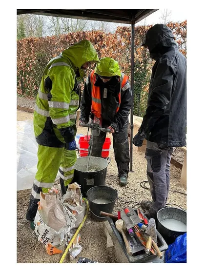 Collaboration on site, even across language barriers. Our team works with local French craftspeople, mixing materials and sharing techniques to execute the design with precision and care.