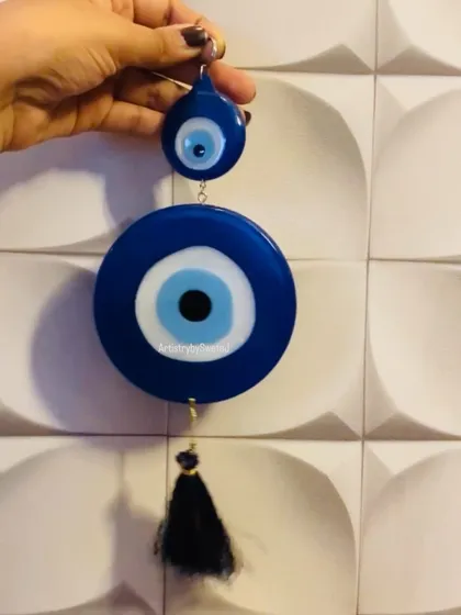 A large evil eye wall hanging, designed to protect your space with style.