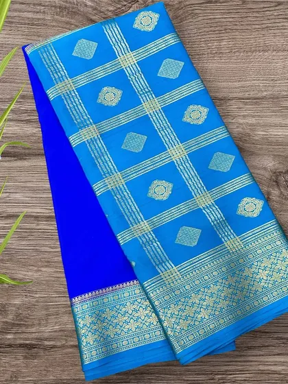 A classic combination of royal blue and sky blue in a half-and-half pure Mysore crepe silk saree design.