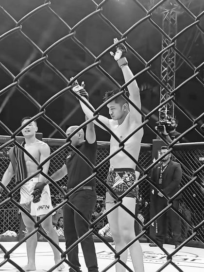 A fighter gets his hand raised in victory inside the cage. This single moment is what every athlete in our fight team works towards.