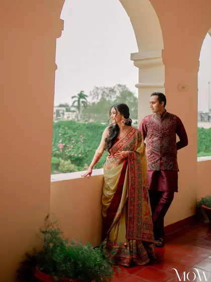 Another stunning shot from the vintage-themed Mehendi, capturing the couple in a royal setting.