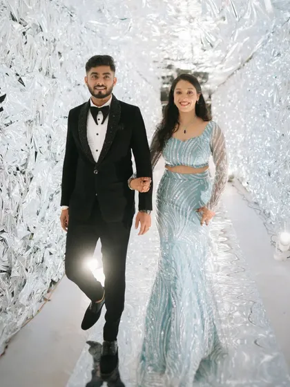 Making a futuristic statement with this incredible silver foil tunnel entrance. It was a bold and unexpected decor choice that created a memorable "wow" moment for guests arriving at the reception.