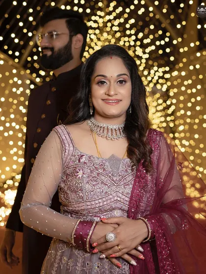 A duplicate of the solo portrait, this image highlights the intricate details of the reception gown and jewelry against the beautifully lit background.