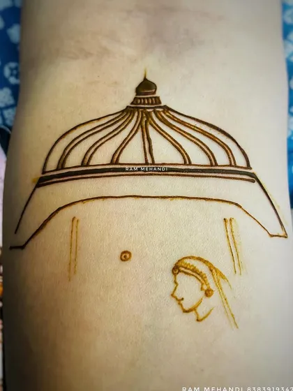 The start of a bridal portrait on the arm, with the outline of the dome and the bride's face.