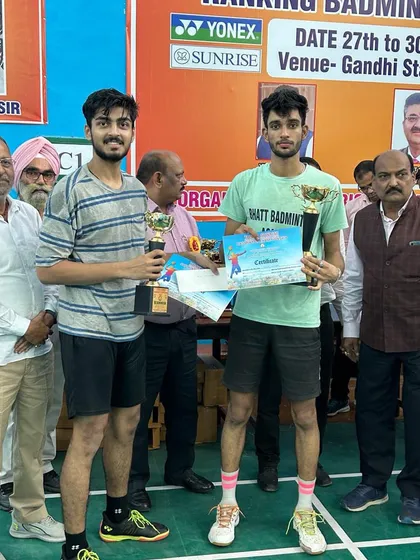 Men's Doubles silver medalists Pradeep Chaudhary and Shivam Srivastava proudly holding their trophies and certificates at the U.P. Senior state ranking tournament.