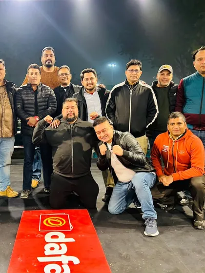 The team posing in the ring. This is our home, and this is our family.