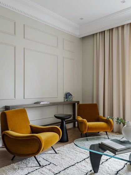 Wall trims are the new trend for accent walls. This image shows how simple mouldings on a wall can add a touch of classic elegance and sophistication to a living space.