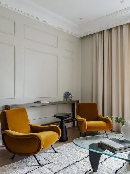 Wall trims are the new trend for accent walls. This image shows how simple mouldings on a wall can add a touch of classic elegance and sophistication to a living space.