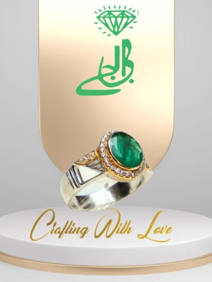 Experience the perfect fusion of elegance and opulence with this magnificent ring. The vibrant green emerald at its center exudes a captivating aura, while the shimmering diamonds add a touch of brilliance.