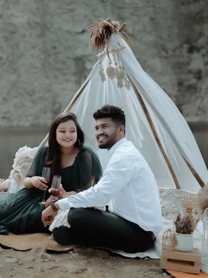 A wide shot of a romantic picnic setup by a quarry, showcasing the beautiful scenery and the thought we put into creating a unique pre-wedding experience.