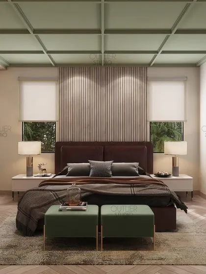 The perfect combination of green, beige, and brown tones creates a calming atmosphere in this bedroom. The coffered green ceiling and herringbone wood floor add unique architectural details.
