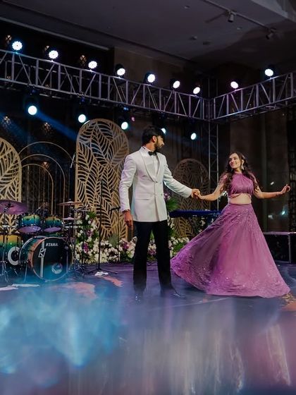 The couple's romantic dance on a smoke-filled stage, creating a magical atmosphere.