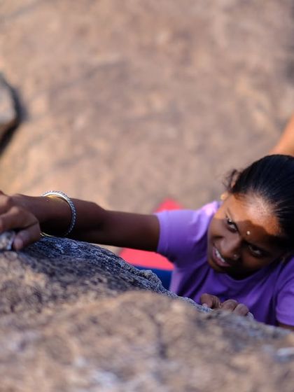 A close-up of one of the young girls from the village trying climbing for the first time, with a CLAW member spotting her. It was amazing to see their pure joy and excitement.