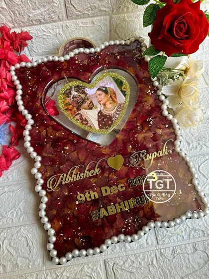 This shot highlights the golden text and the glittery border of the hanging heart photo.