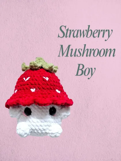 A close up of the Strawberry Mushroom Boy. I love his little face and the detail of the seeds on his strawberry cap. He's a popular custom order that's now a permanent part of my shop.