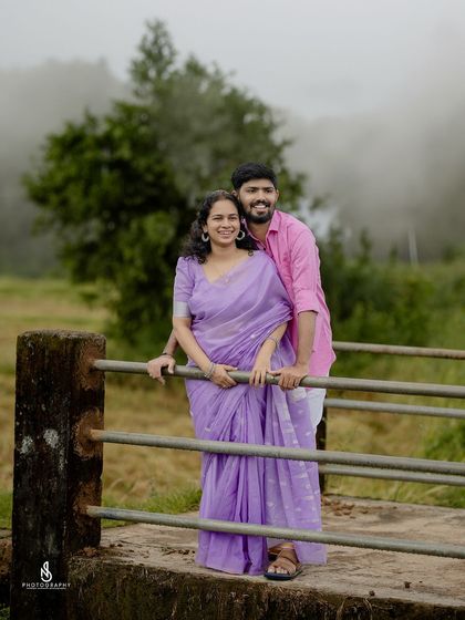 A happy couple portrait on the rustic bridge. This location in Puttur offers a perfect blend of nature and structure.