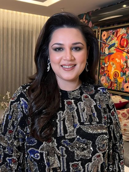 A close-up of the client, her happy expression and flawless makeup making for a perfect picture.