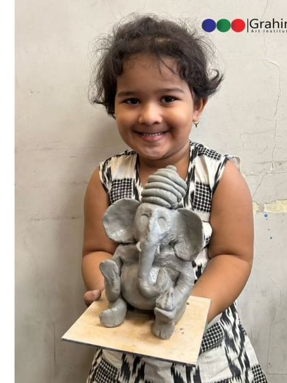 The proud smile of a young artist with her finished Ganpati idol from our workshop at Indoscots Global School. It is moments like these that make teaching so rewarding.